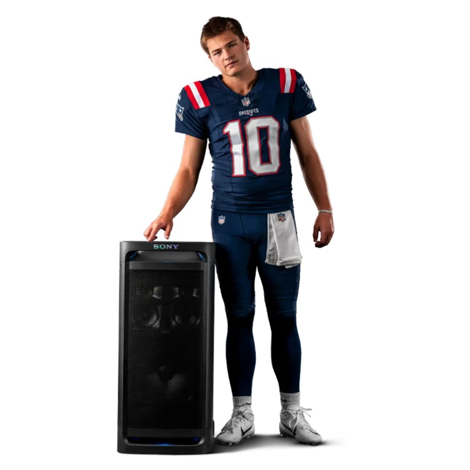 Person in sports uniform standing next to a Sony speaker on a white background