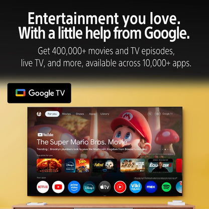 Google TV interface with various app icons on a yellow background, featuring text about entertainment options.